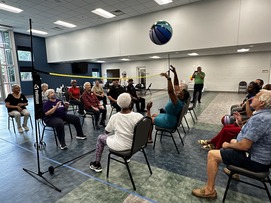 Picture of people playing chair volleyball at TRIAD ice-cream social