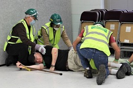 Participants in a CERT class train on providing first aid to an accident victim