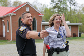 A Chesterfield resident laughs with a police officer during a session of the Police Citizens Academy