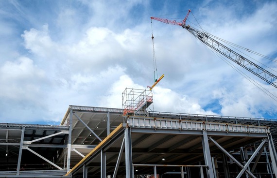 The final structural beam is placed at a topping-out ceremony for LEGO's precision manufacturing facility in Chesterfield