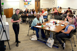 Summer interns work together in a conference room at the county government complex