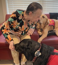 Pine Forest Resident kissing therapy dog