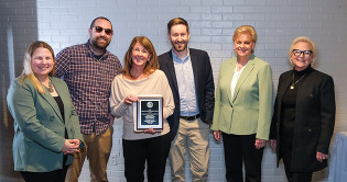 People accepting award at Annual Partners Recognition Dinner