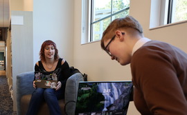 teens on laptops at library