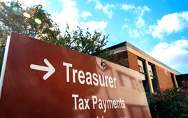 A sign directing visitors to the county government complex to the Treasurer's office