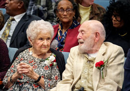 A man and woman in the Public Meeting room during Chesterfield's 2025 centenarian celebration