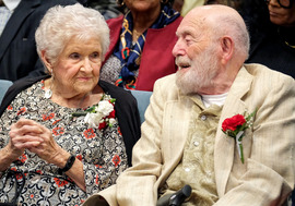 A man and woman in the Public Meeting room during Chesterfield's 2025 centenarian celebration