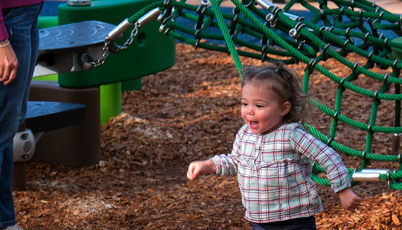 A young girl plays on the playground at Cogbill Park