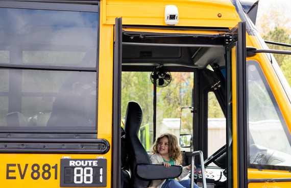 little girl in schoolbus