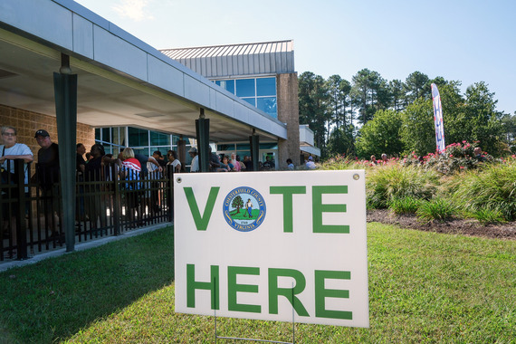 Chesterfield residents wait in line to cast their ballots during early voting at Central Library