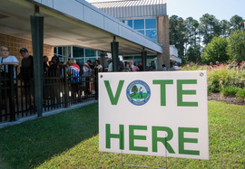 Chesterfield residents wait in line to cast their ballots during early voting at Central Library