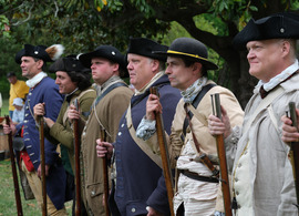Revolutionary War reenactors with muskets at Historic Eppington