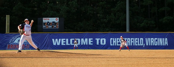 A young baseball player delivers a pitch during the Bronco-11 World Series in Chesterfield