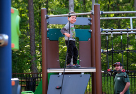 A child plays on playground equipment at Cogbill Park