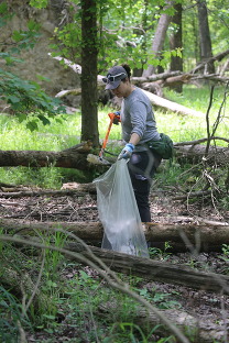 DEQ staff picking up plastic trash