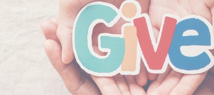 Hands spread with the word "GIVE"