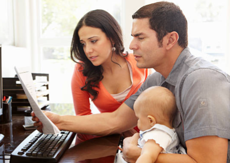 Family looking at computer together