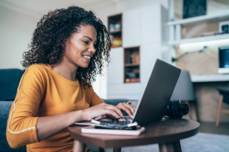 Woman on computer at her home