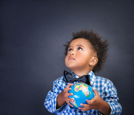 toddler holding globe