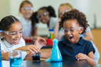 elementary students conducting chemistry experiment