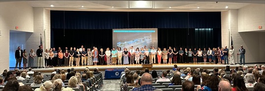 A large group of people on stage