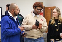 Students speaking with the business community