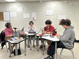 Students and a teacher recording a podcast