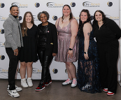 Smiling staff at the gala