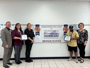 Staff with Governors Scorecard banner