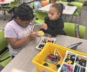 Students building with legos