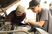 Students working on a car