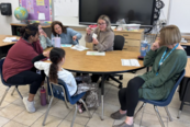 Teachers and student collaborating