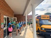 Community members handing out to-go meals