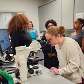 Student looking in a microscope