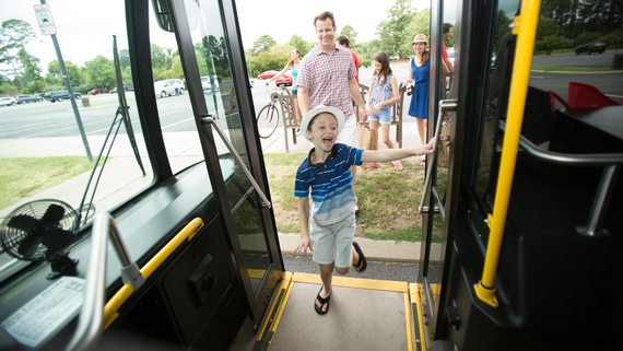 People boarding WATA bus