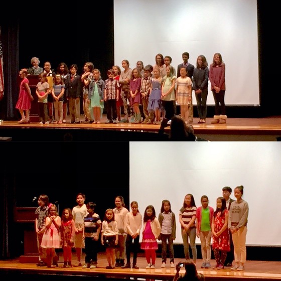 Several Clermont students on stage to recieve their PTA Reflections rewards