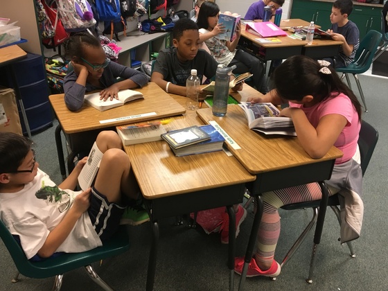 photos of students reading at their desks