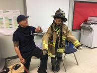 photo of student wearing firefighter gear