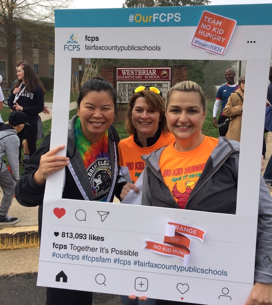 Westbriar ES staff holding #OurFCPS frame