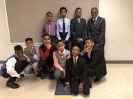 6th grade boys dressed up in suits and ties for their promotion ceremony