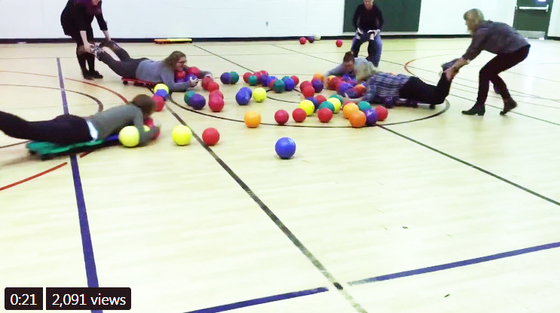 Greenbriar East ES teachers playing a human version of Hungry Hippos after a day of professional development.