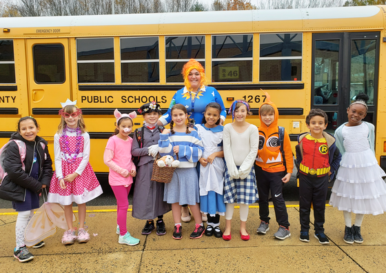 Teacher and students dressed up as book characters
