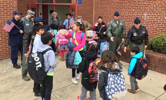 Photo of veterans greeting students