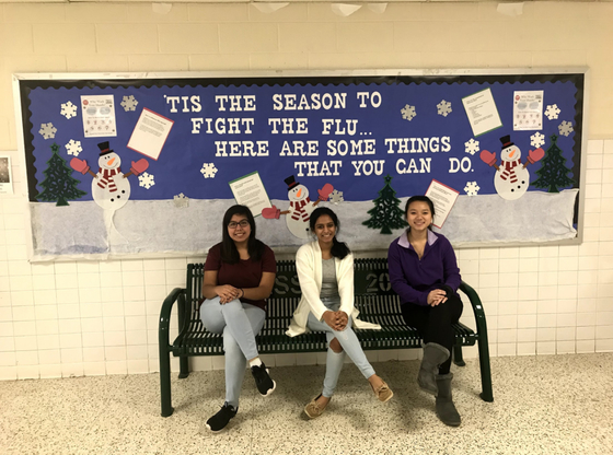 Picture of students near influenza bulletin board