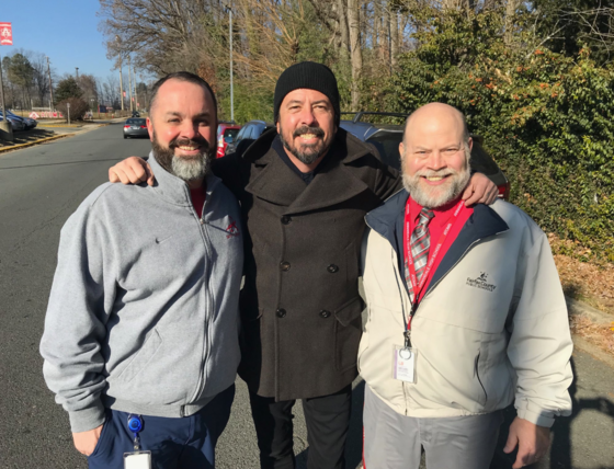 Annandale HS Safety and Security Specialist Chris Tippens, Drummer Dave Grohl, and AHS Principal Tim Thomas