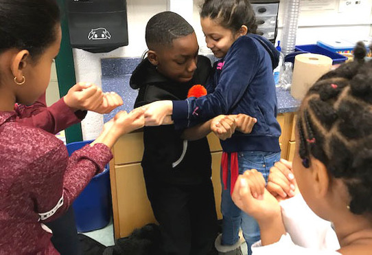 Photo of students participating in a Positivity Project exercise