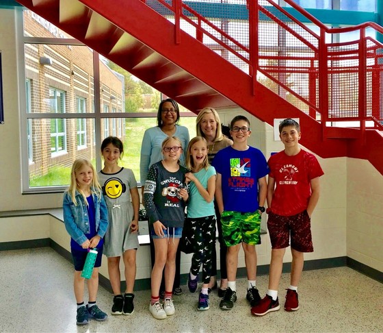 Students pose with Principal Stokowski and Assistant Principal Peace in the front lobby.