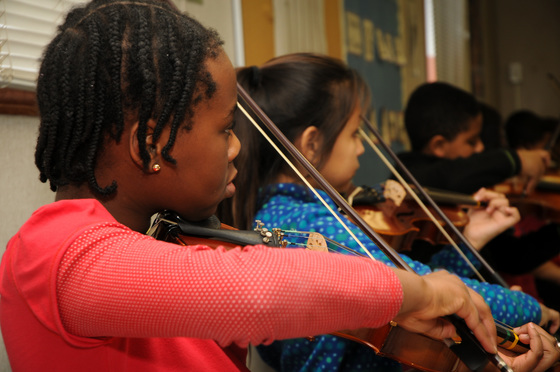 Photo of students playing violins