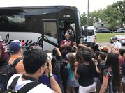 Redskins players getting off of a bus at Brookfield