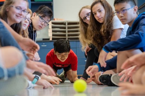 Students experiment with tennis ball